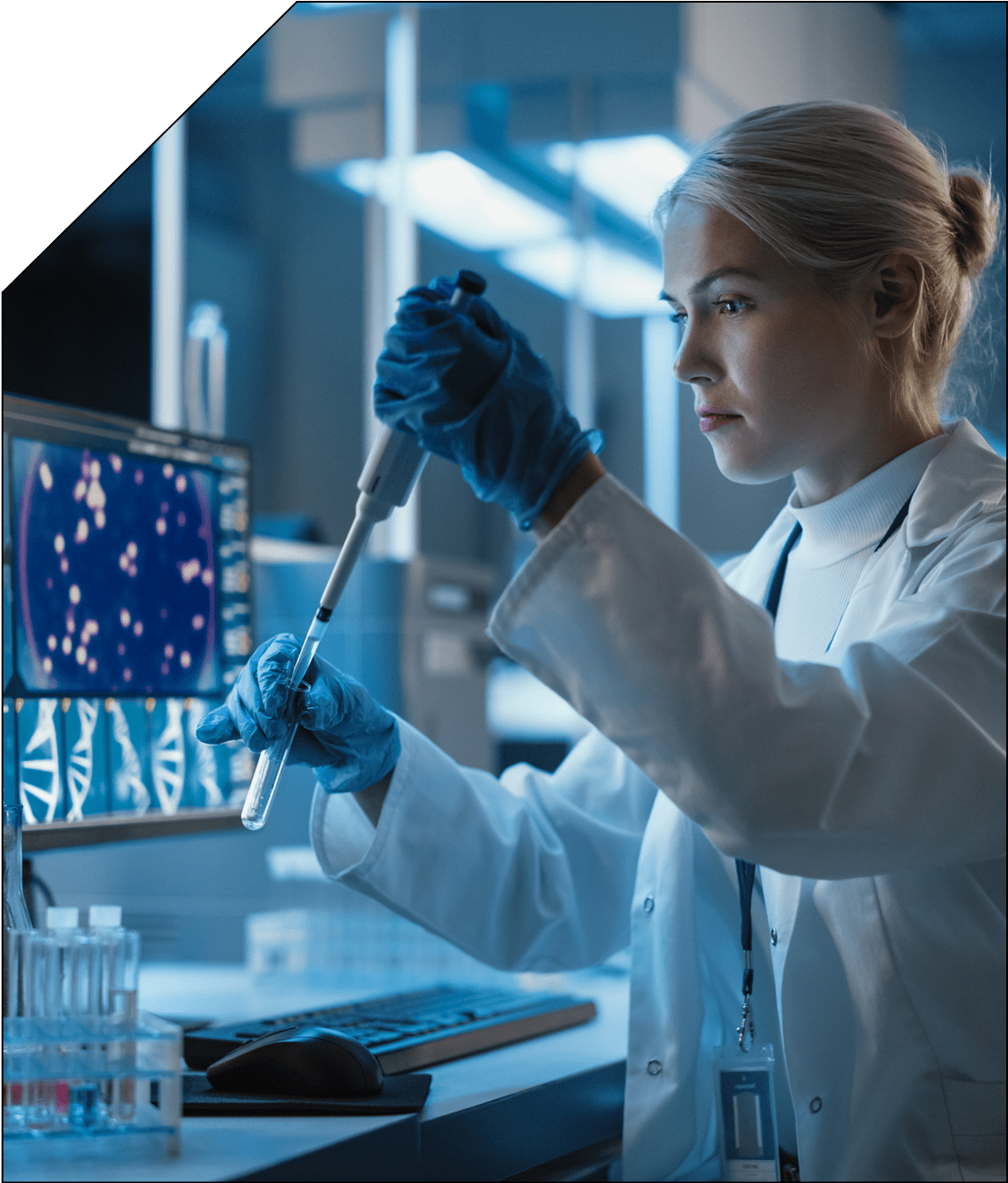 Scientist analyzing samples with a pipette in a high-tech lab.